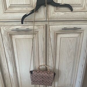 Faux leather bag with long gold toned chain strap and hardware